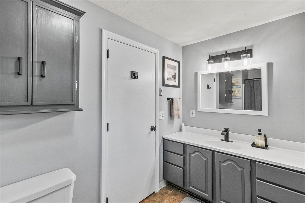 69 Appleton Road Auburn, MA 01501 - Photo 18 of 42 a bathroom with a double vanity sink and mirror