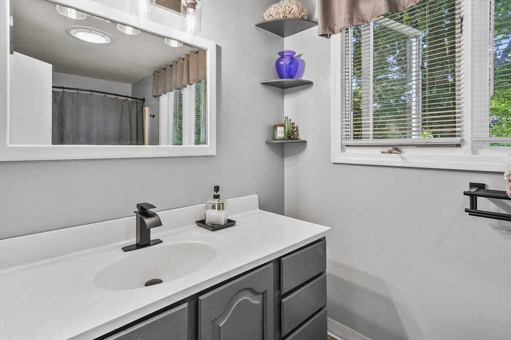 69 Appleton Road Auburn, MA 01501 - Photo 19 of 42 a bathroom with a sink and a window