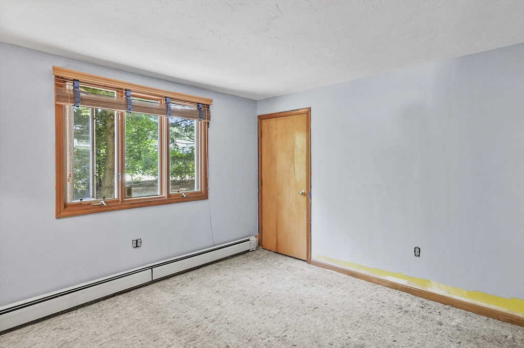 69 Appleton Road Auburn, MA 01501 - Photo 21 of 42 a view of an empty room with a window
