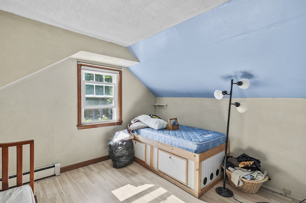 69 Appleton Road Auburn, MA 01501 - Photo 24 of 42 a living room with hard wood floor and a window