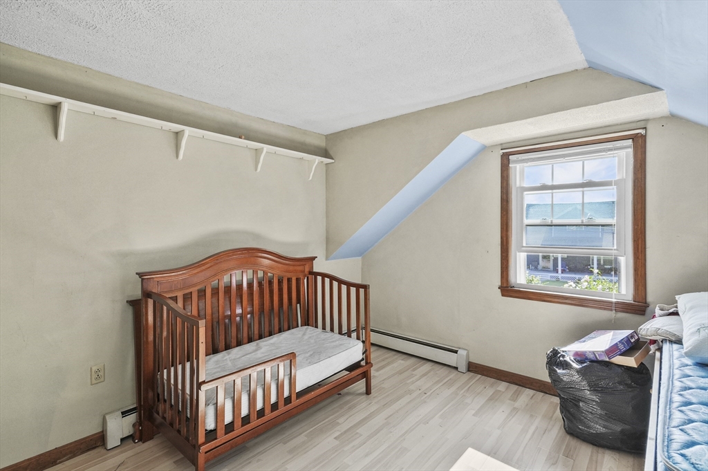 69 Appleton Road Auburn, MA 01501 - Photo 26 of 42 a bedroom with furniture and a window