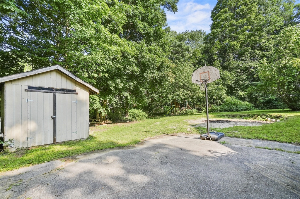69 Appleton Road Auburn, MA 01501 - Photo 32 of 42 a view of a house with backyard and a tree