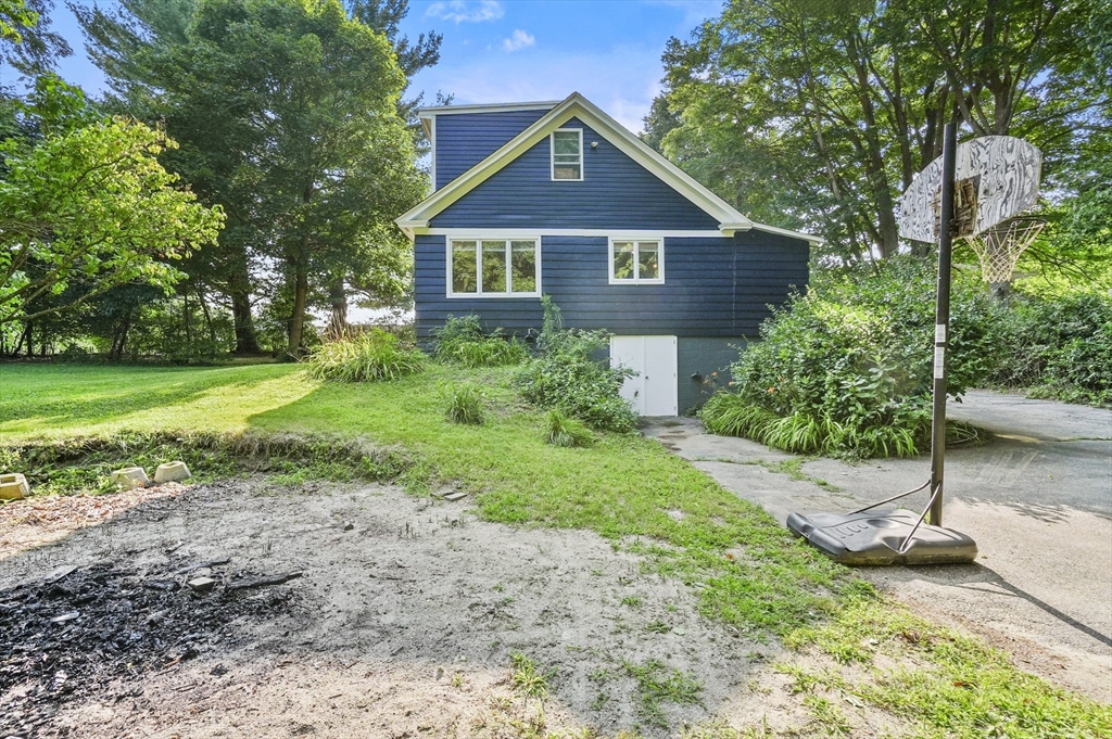 69 Appleton Road Auburn, MA 01501 - Photo 38 of 42 a front view of a house with a yard and garage
