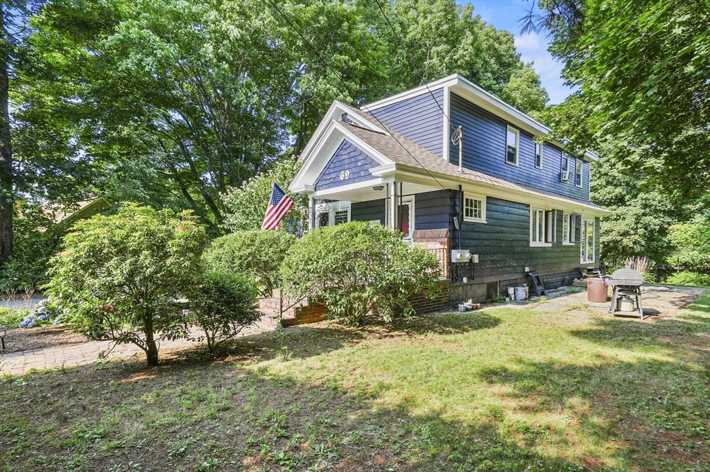 69 Appleton Road Auburn, MA 01501 - Photo 40 of 42 a front view of a house with a yard and trees