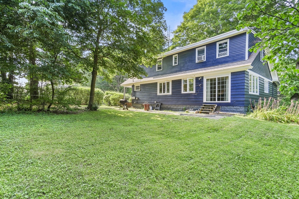 69 Appleton Road Auburn, MA 01501 - Photo 41 of 42 a front view of a house with a yard