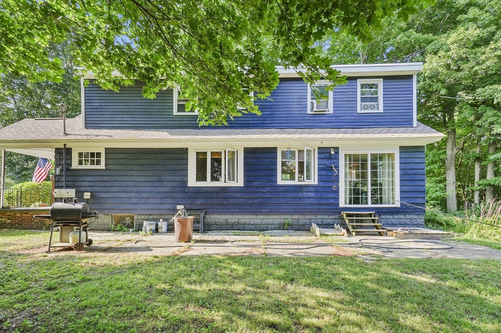 69 Appleton Road Auburn, MA 01501 - Photo 42 of 42 a front view of a house with a yard