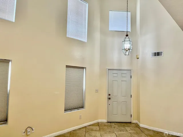 a view of a closet with wooden floor