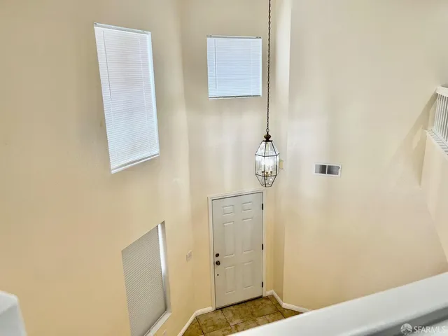 a bathroom with a granite countertop shower sink and mirror