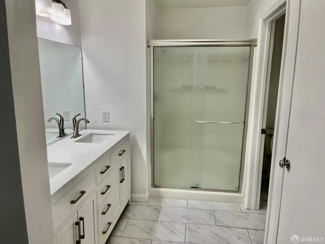 a room with wooden floor and cabinets