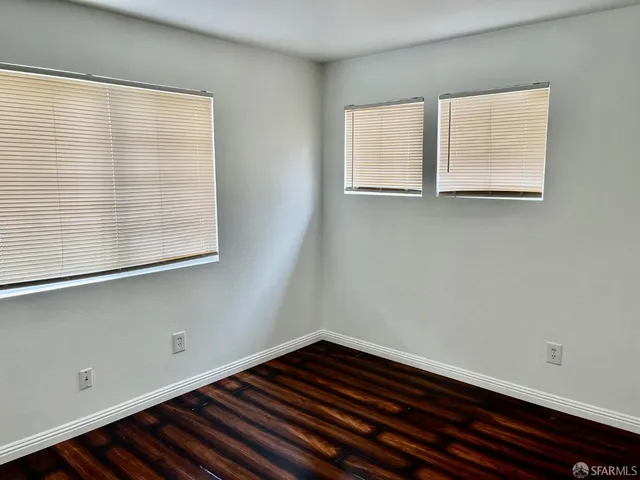a bathroom with a sink a light fixture and a toilet
