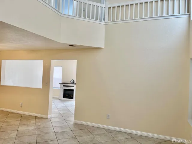 a room with a sink and a stove top oven