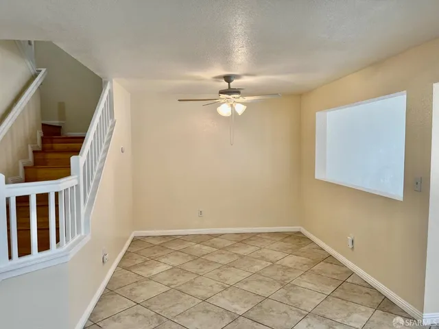 a kitchen with stainless steel appliances kitchen island granite countertop a refrigerator and a sink
