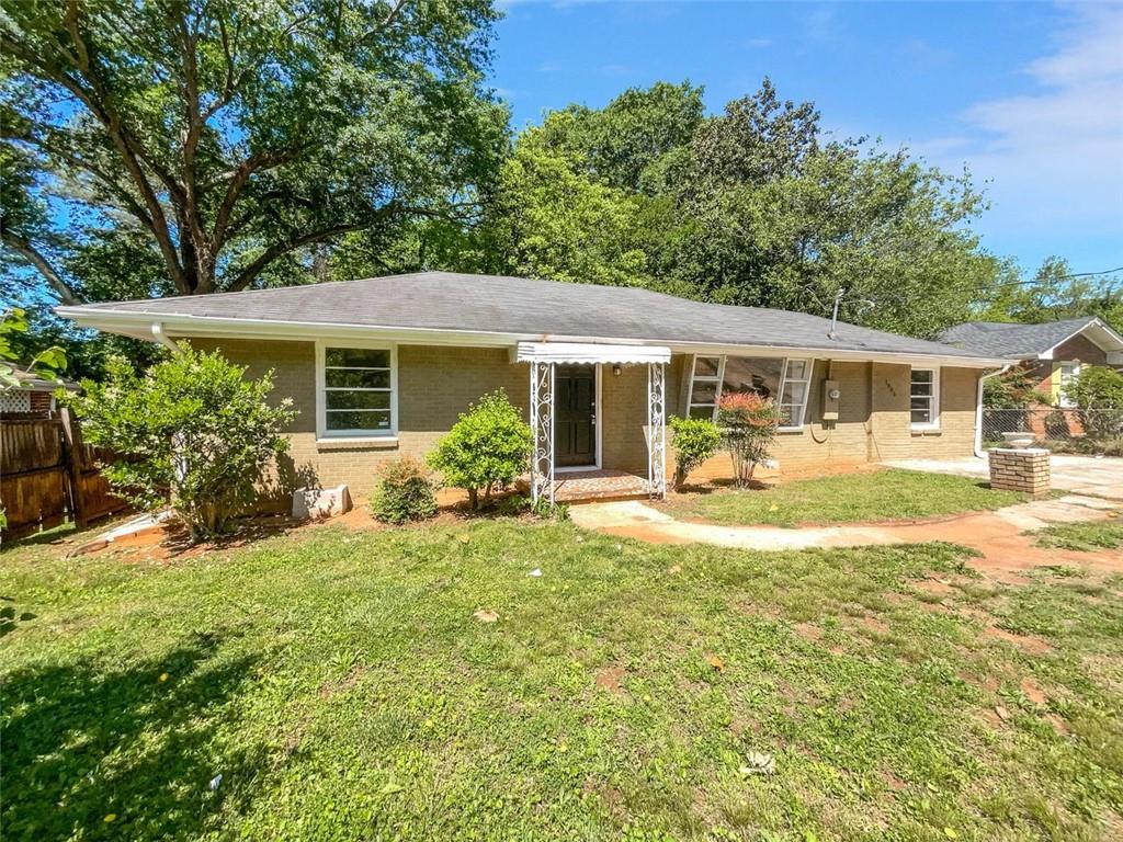 1985 Columbia Drive Decatur, GA 30032 - Photo 1 of 1 a view of a house with swimming pool and porch with furniture