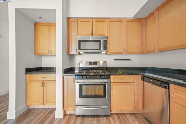 a kitchen with a stove and a microwave