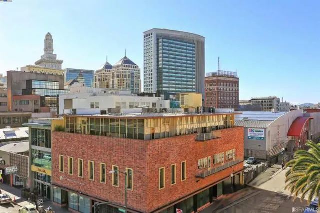 a view of a tall building on the roof deck