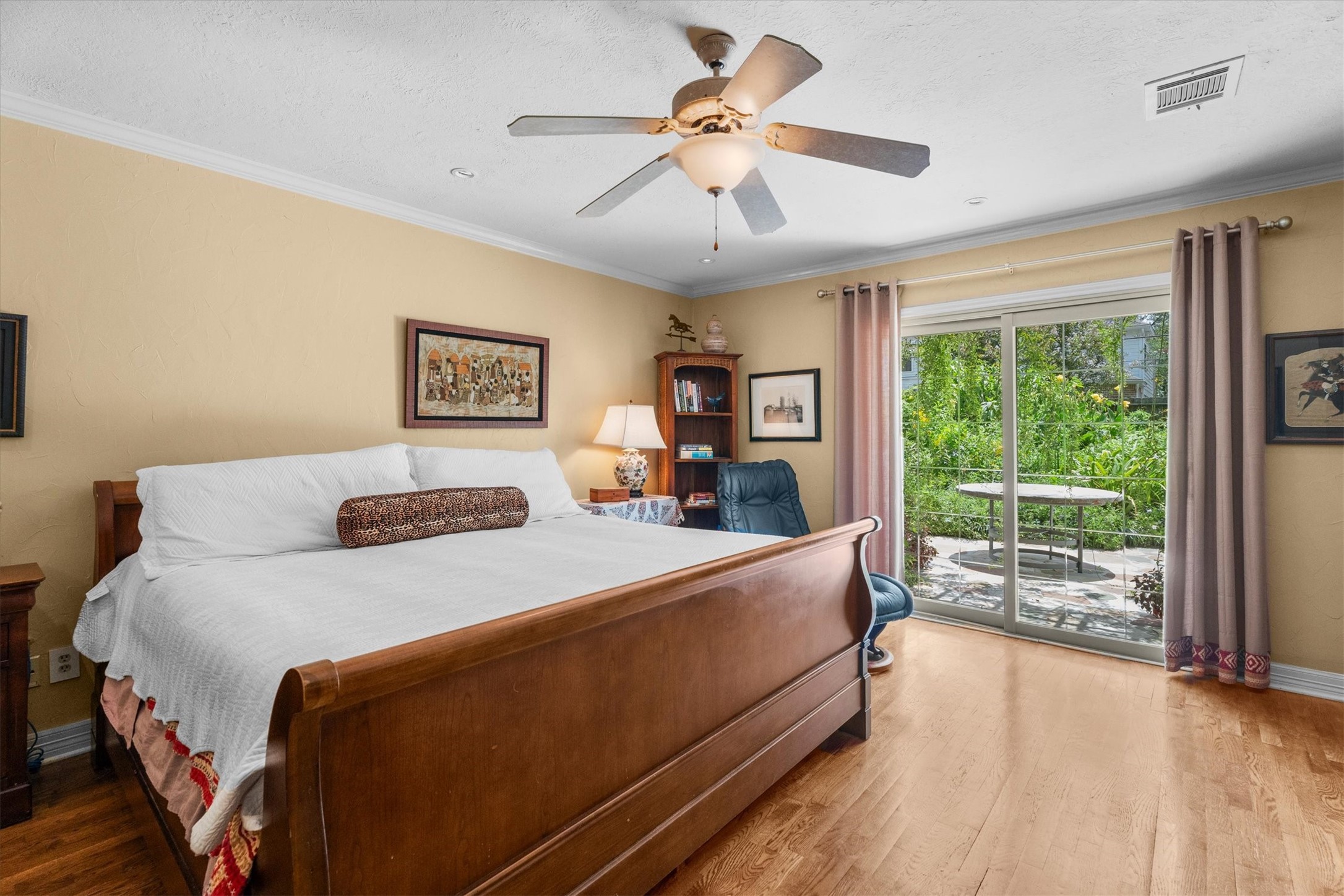 9103 Herts Road Spring, TX 77379 - Photo 22 of 46 The primary bedroom offers sliding doors to a private patio outside.