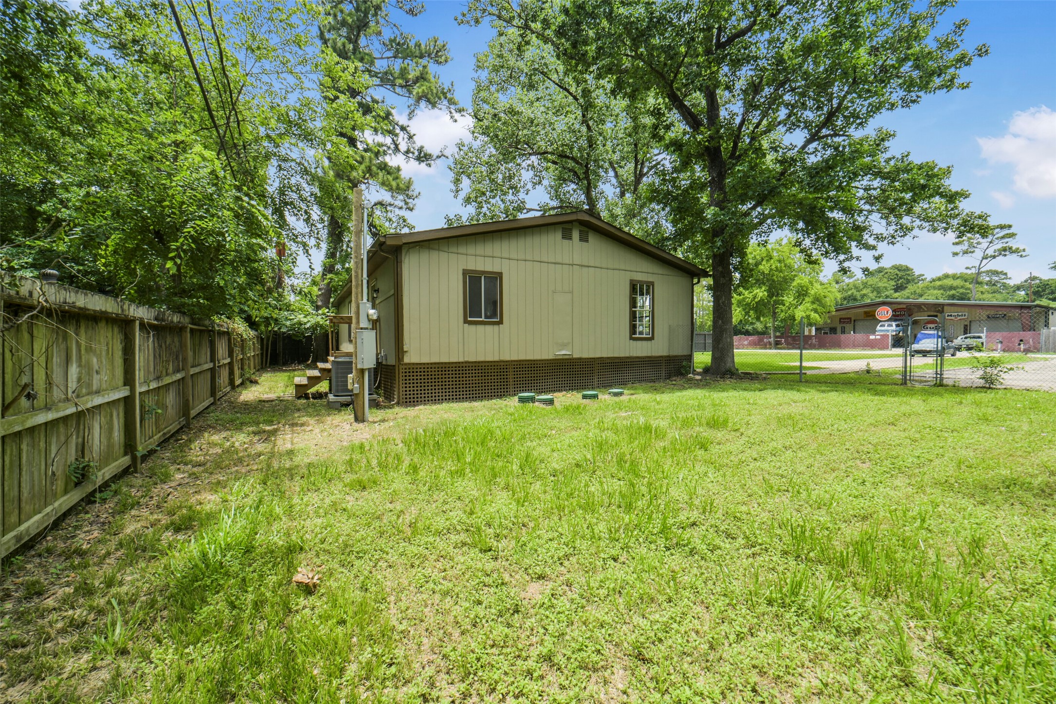 11023 Forrest Valley Drive Houston, TX 77065 - Photo 33 of 47 a backyard of a house with lots of green space