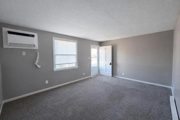 a view of an empty room with a window