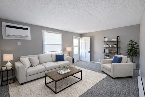 a living room with furniture and a large window