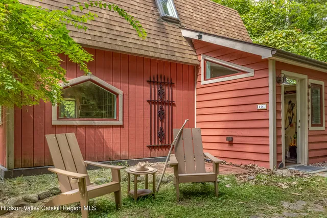 a bedroom with a bed and a lamp
