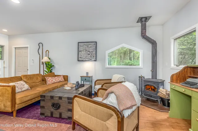 a bathroom with a sink mirror and a shower