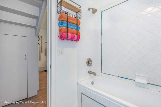 a white toilet sitting next to a bathroom