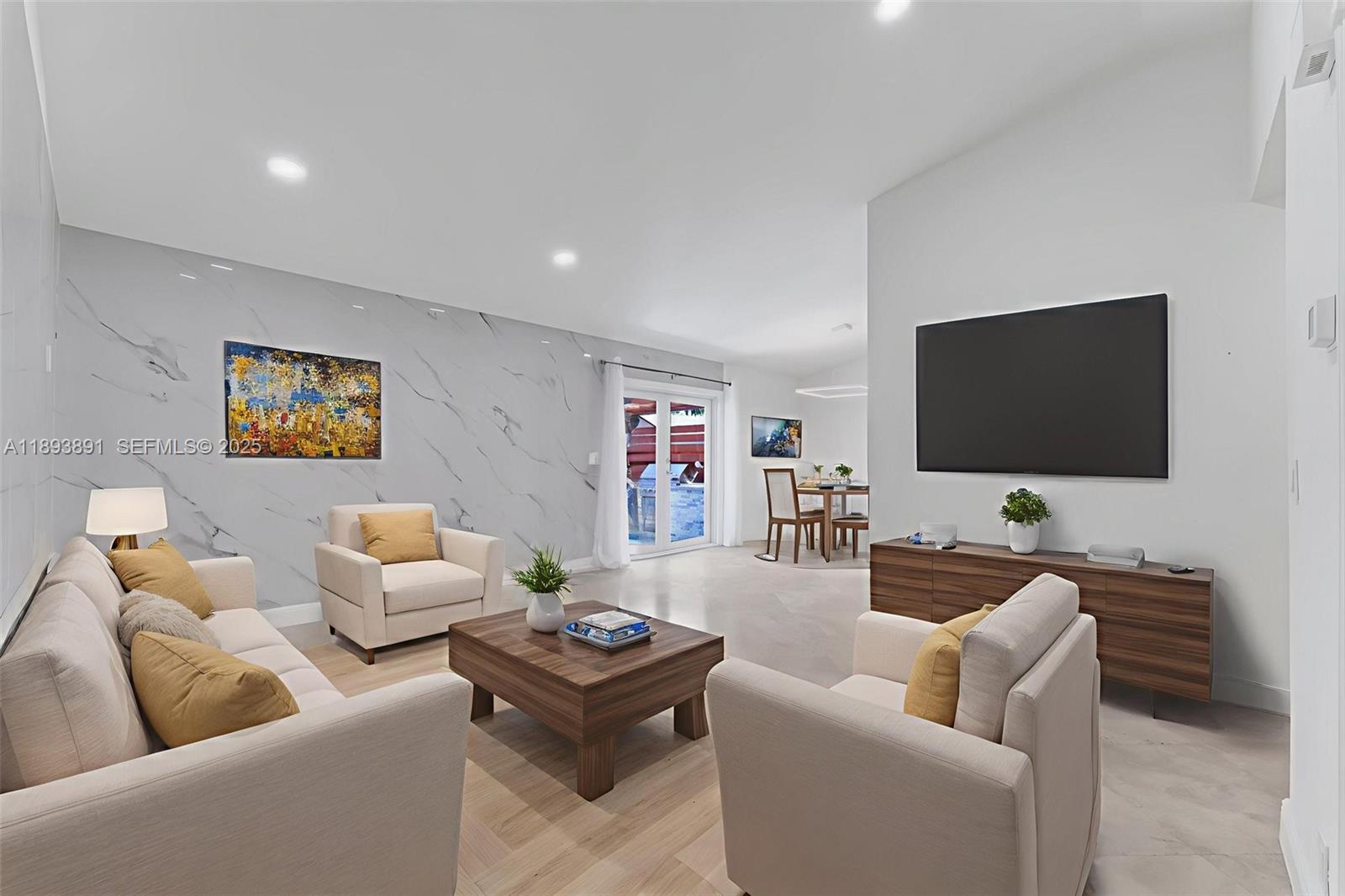 9801 Ridge Creek Road Boca Raton, FL 33496 - Photo 13 of 54 a living room with furniture and a flat screen tv