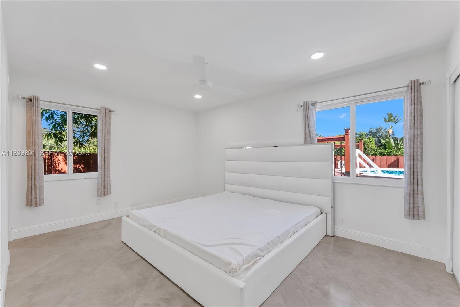 9801 Ridge Creek Road Boca Raton, FL 33496 - Photo 25 of 54 a bedroom with a bed and a painting on the wall