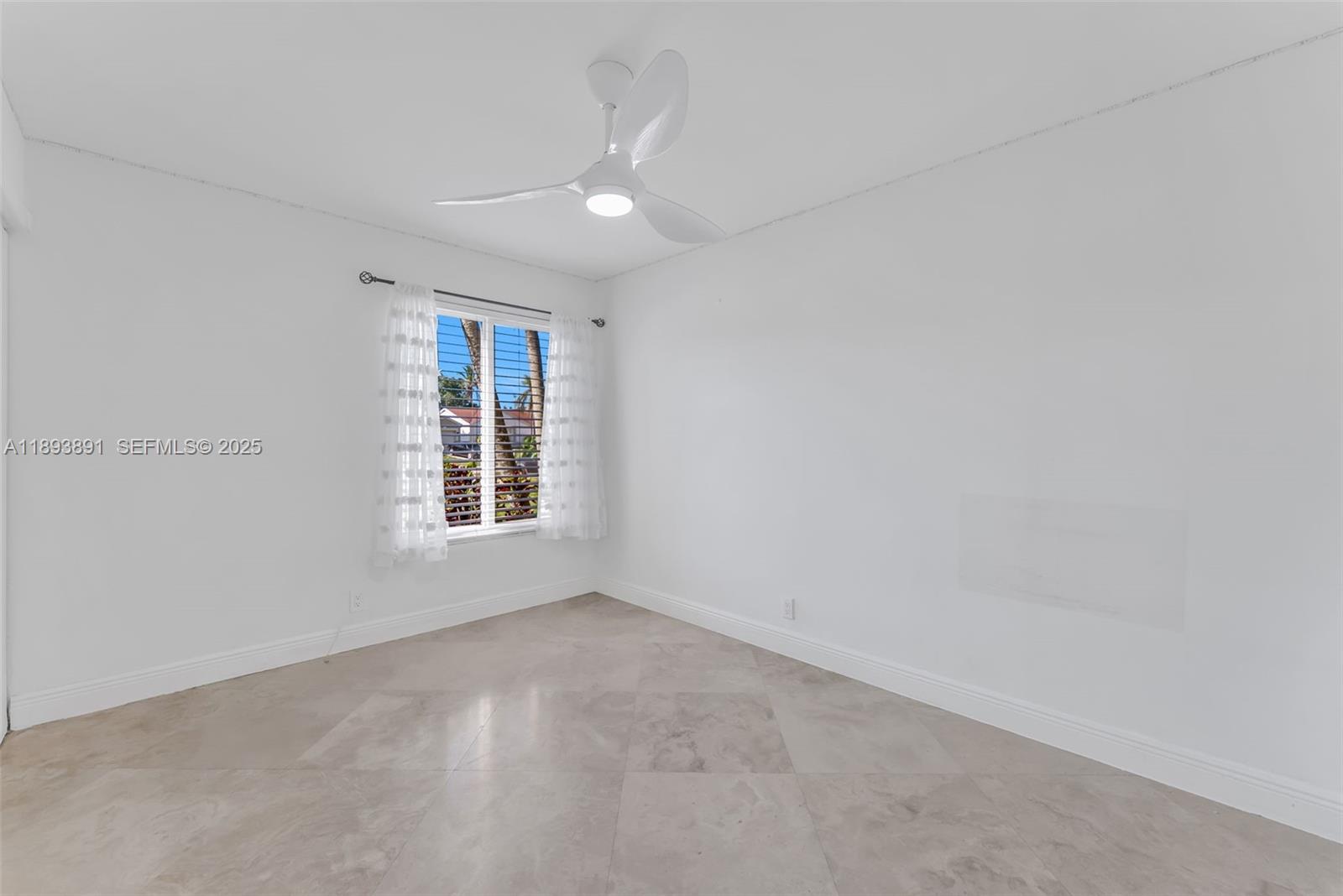 9801 Ridge Creek Road Boca Raton, FL 33496 - Photo 27 of 54 an empty room with a window