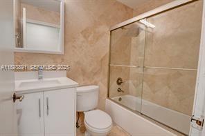 9801 Ridge Creek Road Boca Raton, FL 33496 - Photo 32 of 54 a bathroom with a sink toilet and shower