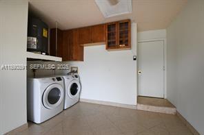 9801 Ridge Creek Road Boca Raton, FL 33496 - Photo 33 of 54 a utility room with dryer and washer