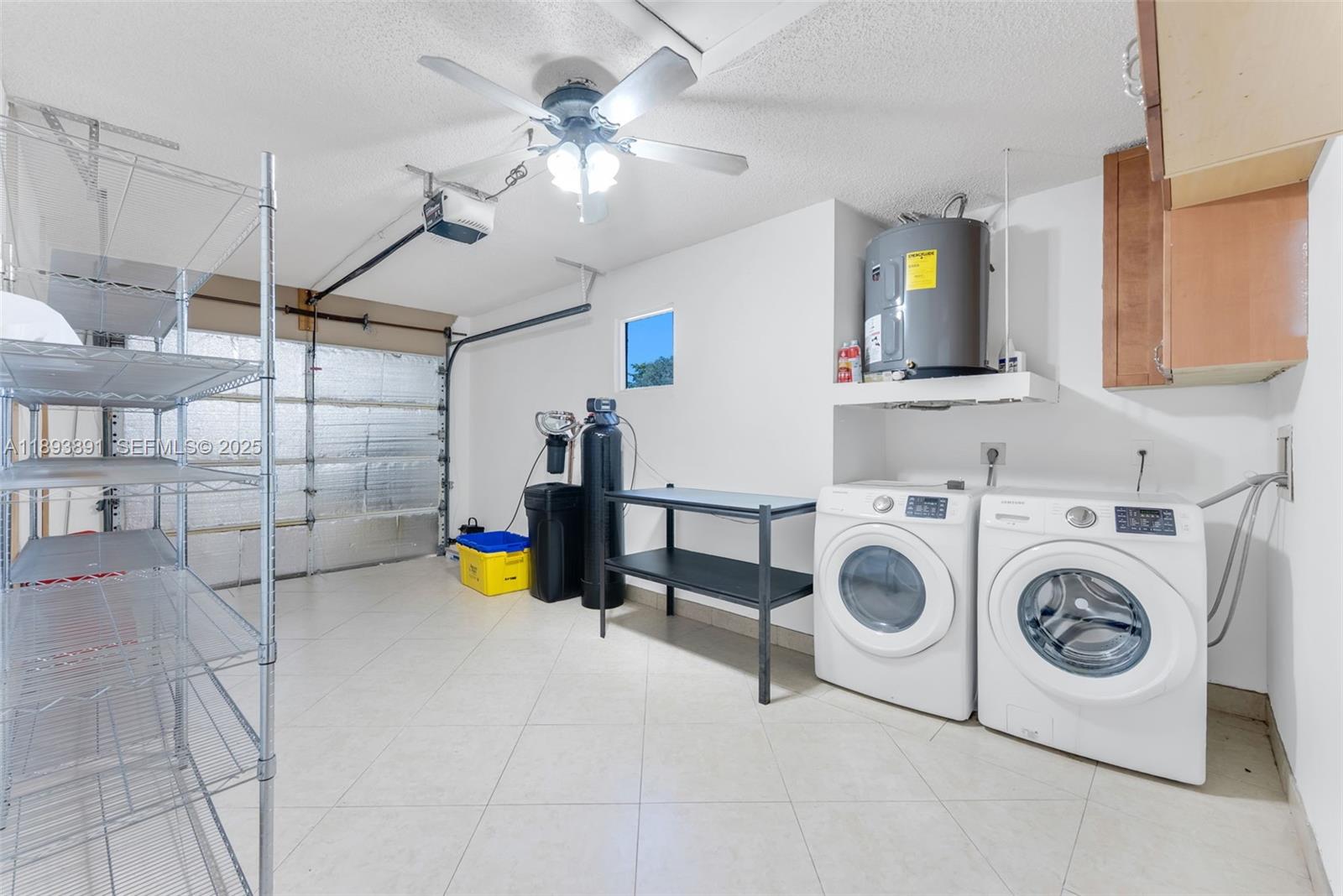 9801 Ridge Creek Road Boca Raton, FL 33496 - Photo 34 of 54 a view of storage and utility room with washer and dryer