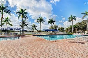 9801 Ridge Creek Road Boca Raton, FL 33496 - Photo 36 of 54 a view of swimming pool with outdoor seating and plants