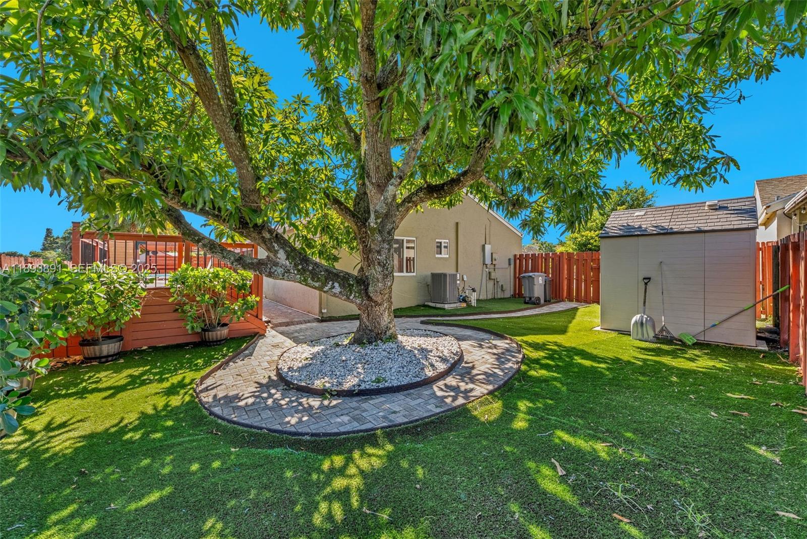 9801 Ridge Creek Road Boca Raton, FL 33496 - Photo 46 of 54 a front view of a house with a yard
