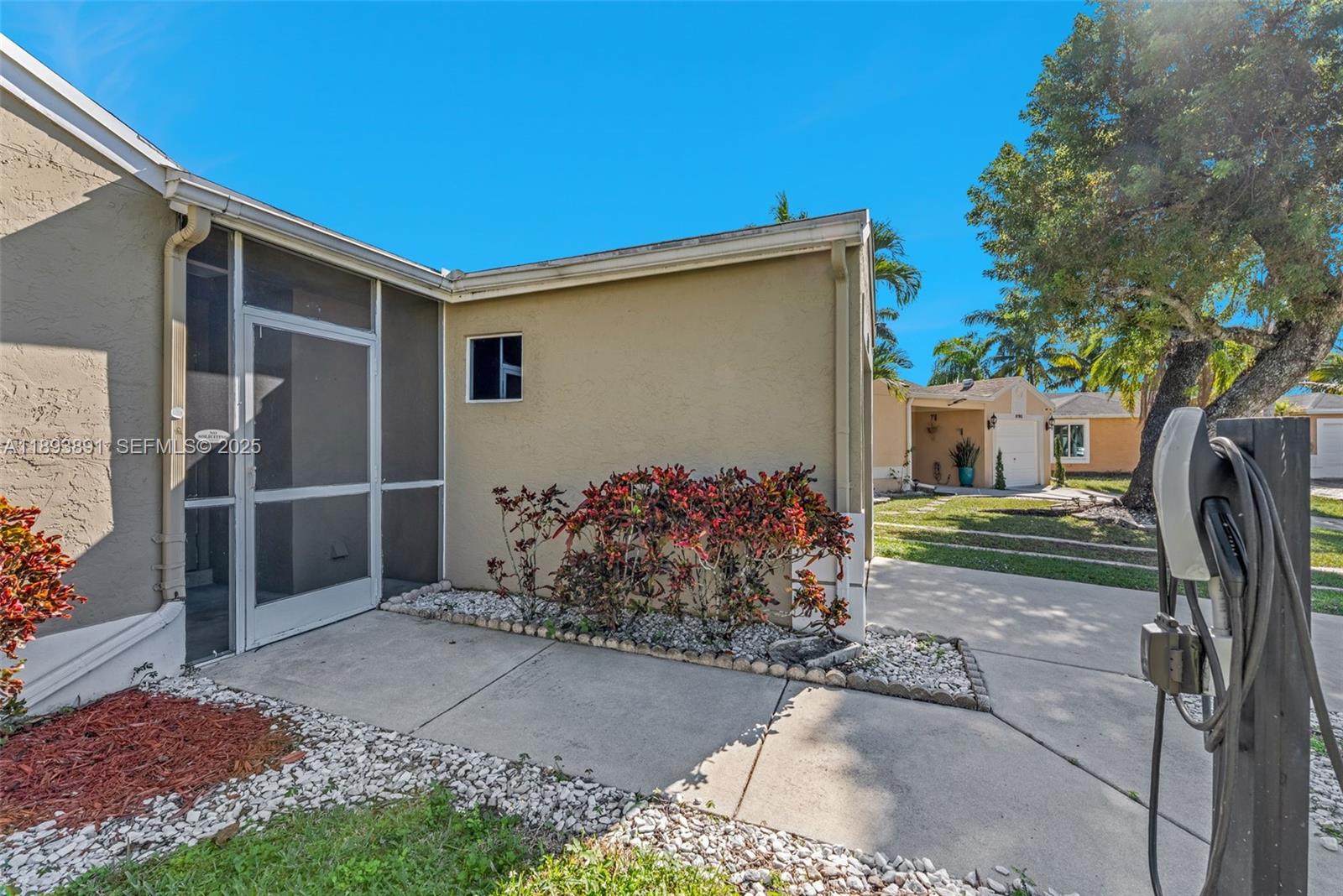 9801 Ridge Creek Road Boca Raton, FL 33496 - Photo 49 of 54 a front view of a house with garden