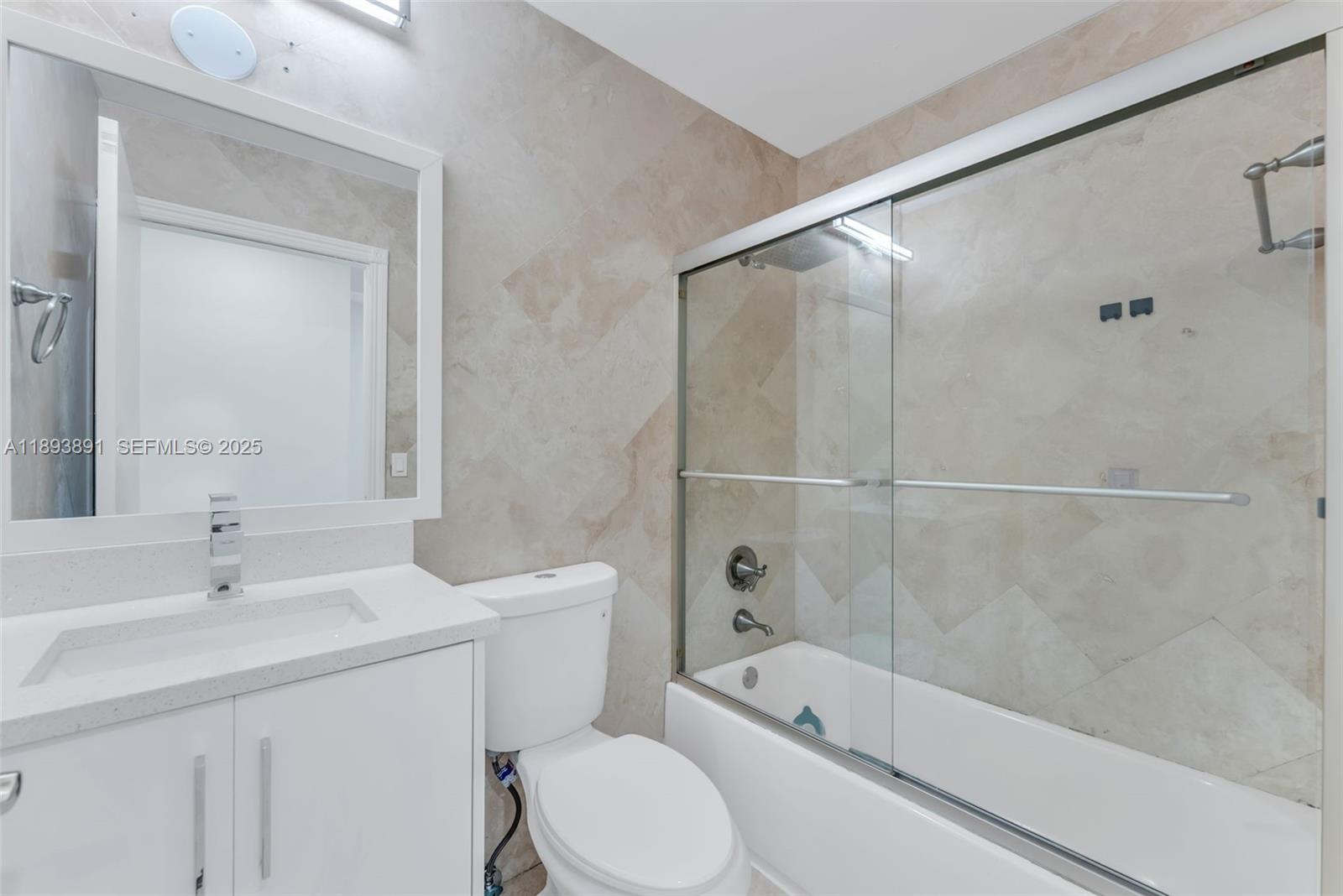 9801 Ridge Creek Road Boca Raton, FL 33496 - Photo 51 of 54 a bathroom with a sink a toilet and shower