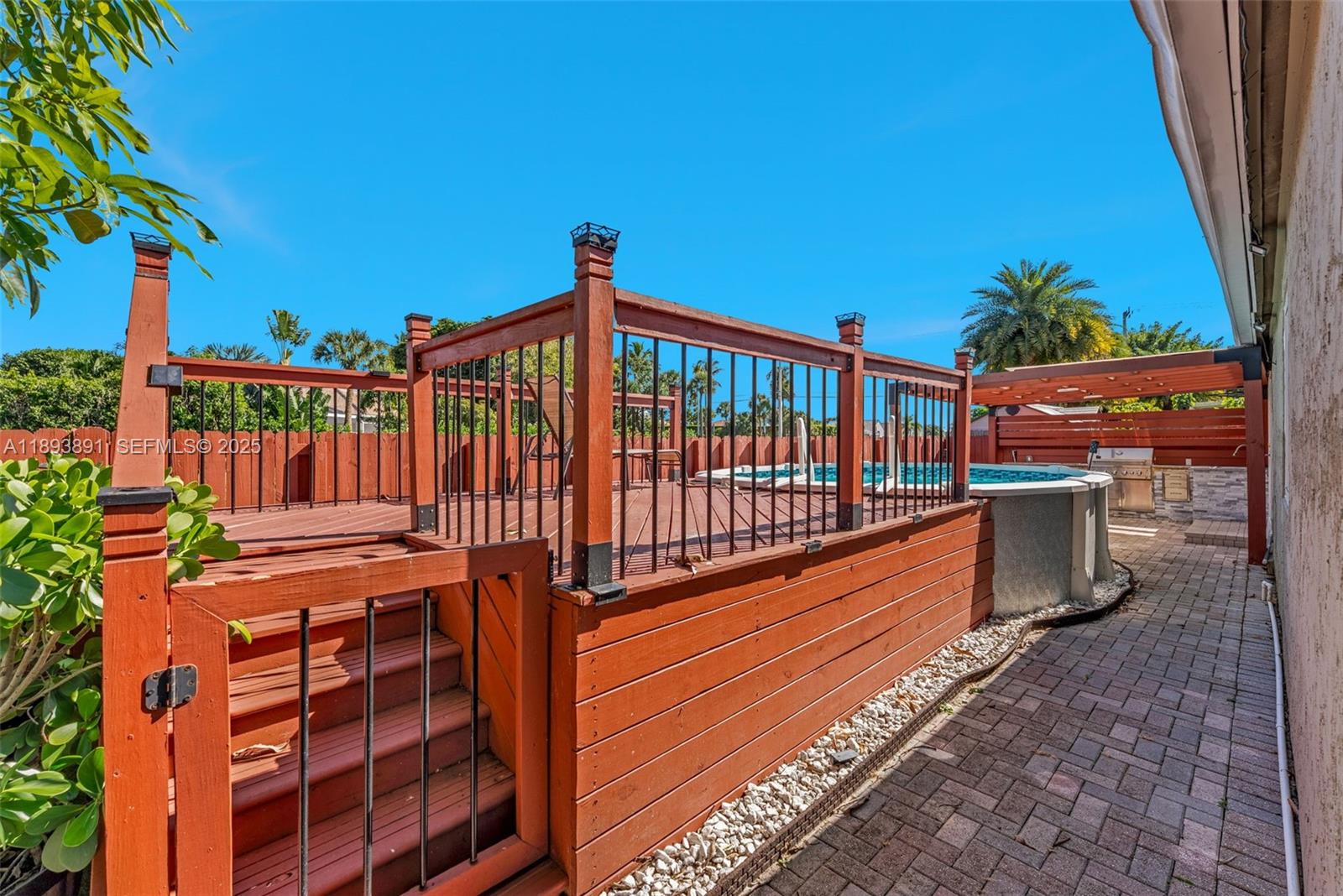 9801 Ridge Creek Road Boca Raton, FL 33496 - Photo 52 of 54 a view of a balcony with chairs