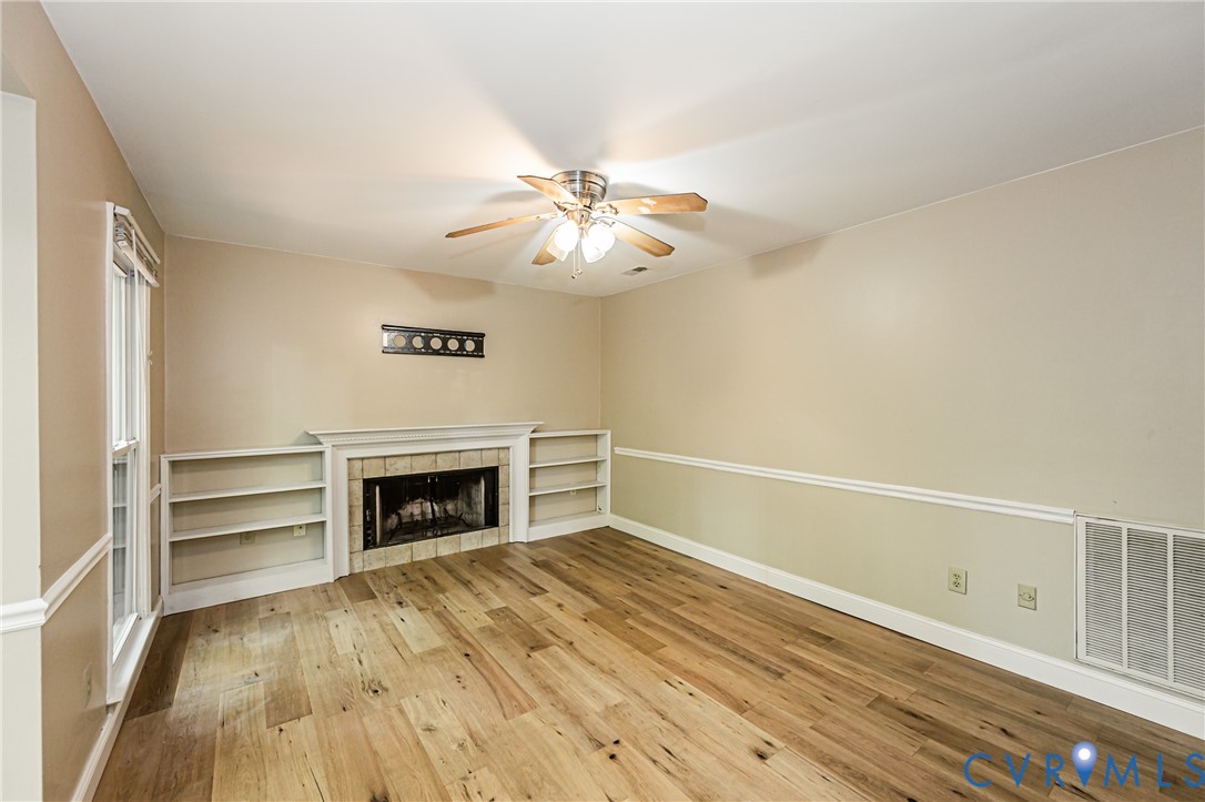 2806 Cove Ridge Road Midlothian, VA 23112 - Photo 25 of 52 Wood-finish flooring, built-in shelving, fireplace