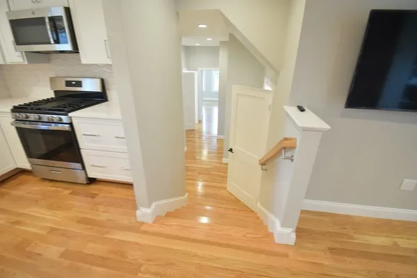 a view of a kitchen cabinets and wooden floor