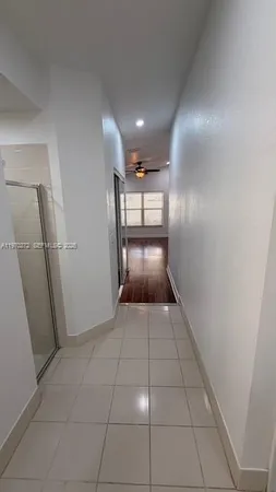 a bathroom with a glass shower door