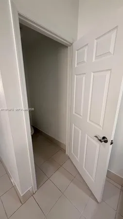 a view of a porch with chairs and backyard