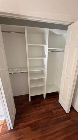 a view of room with hardwood floor