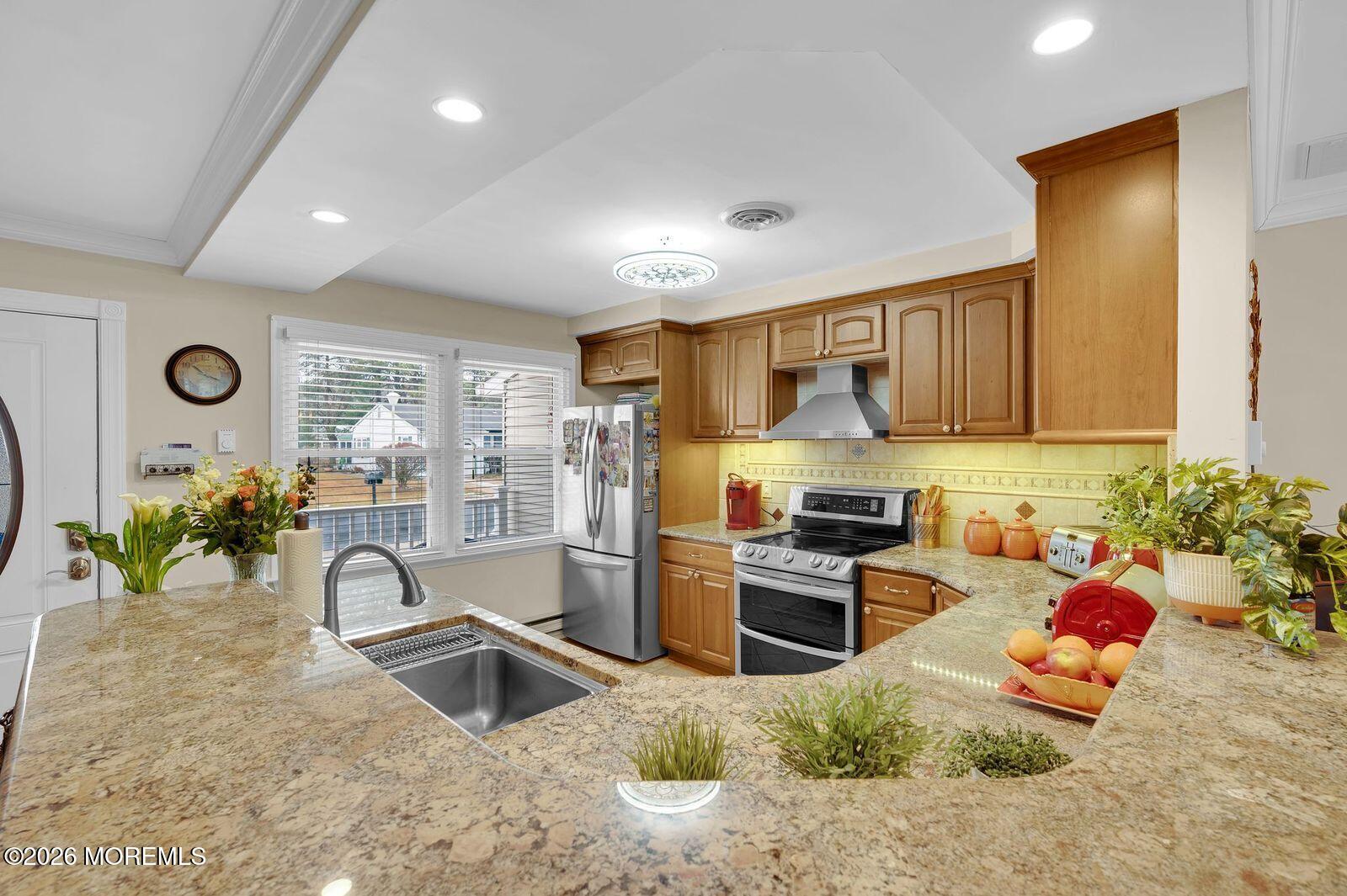 7 Eaton Lane, Unit 73 Whiting, NJ 08759 - Photo 13 of 37 a kitchen with sink refrigerator and stove