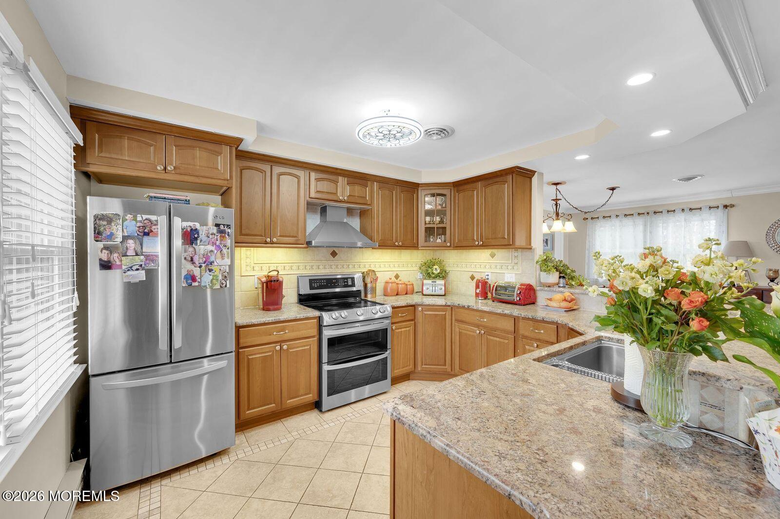 7 Eaton Lane, Unit 73 Whiting, NJ 08759 - Photo 16 of 37 a kitchen with granite countertop stainless steel appliances and white cabinets
