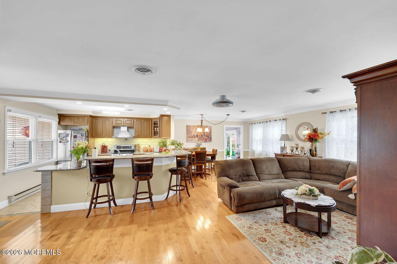 7 Eaton Lane, Unit 73 Whiting, NJ 08759 - Photo 19 of 37 a living room with furniture and a large window