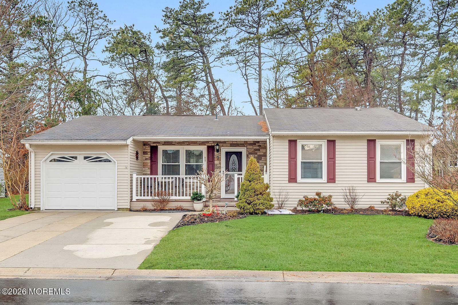 7 Eaton Lane, Unit 73 Whiting, NJ 08759 - Photo 2 of 37 front view of a house with a yard