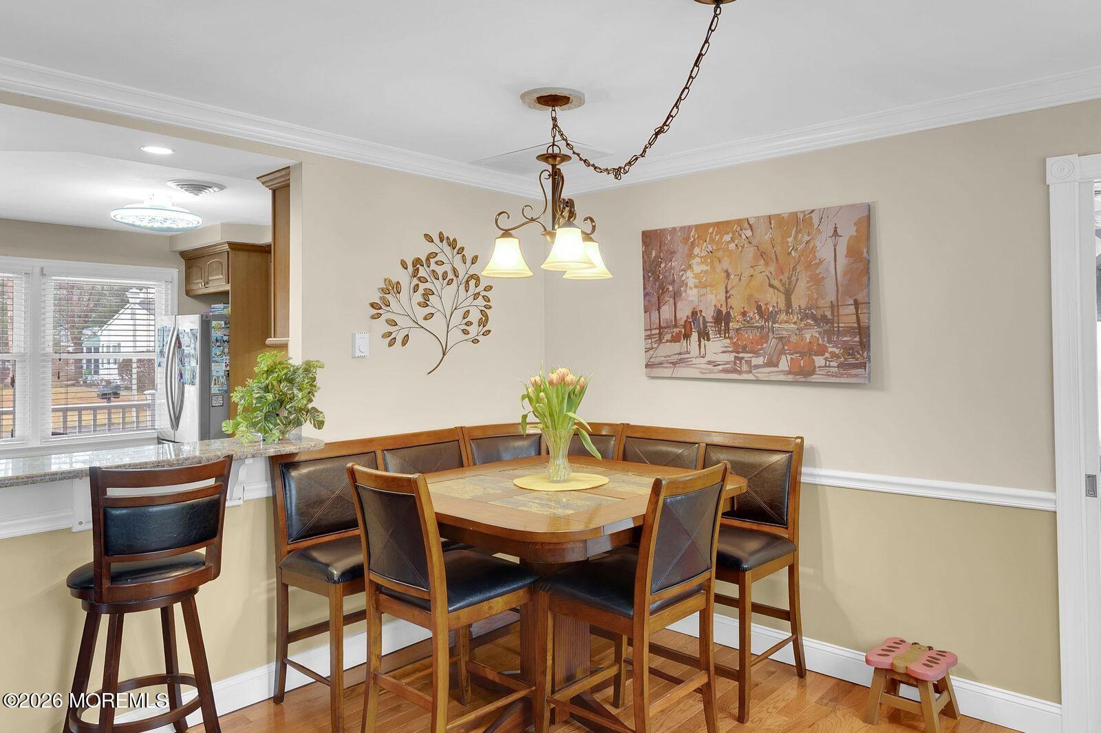 7 Eaton Lane, Unit 73 Whiting, NJ 08759 - Photo 22 of 37 a view of a dining room with furniture and chandelier
