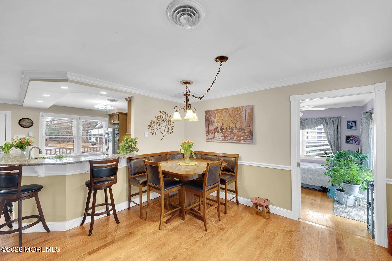 7 Eaton Lane, Unit 73 Whiting, NJ 08759 - Photo 23 of 37 a view of a dining room with furniture and wooden floor