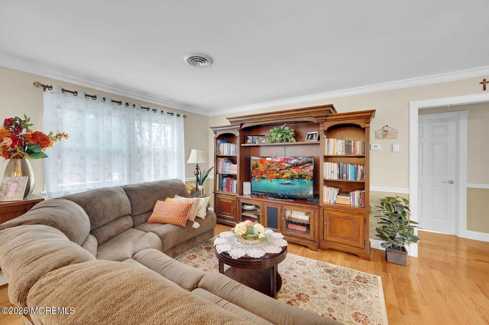 7 Eaton Lane, Unit 73 Whiting, NJ 08759 - Photo 27 of 37 a living room with furniture and a flat screen tv
