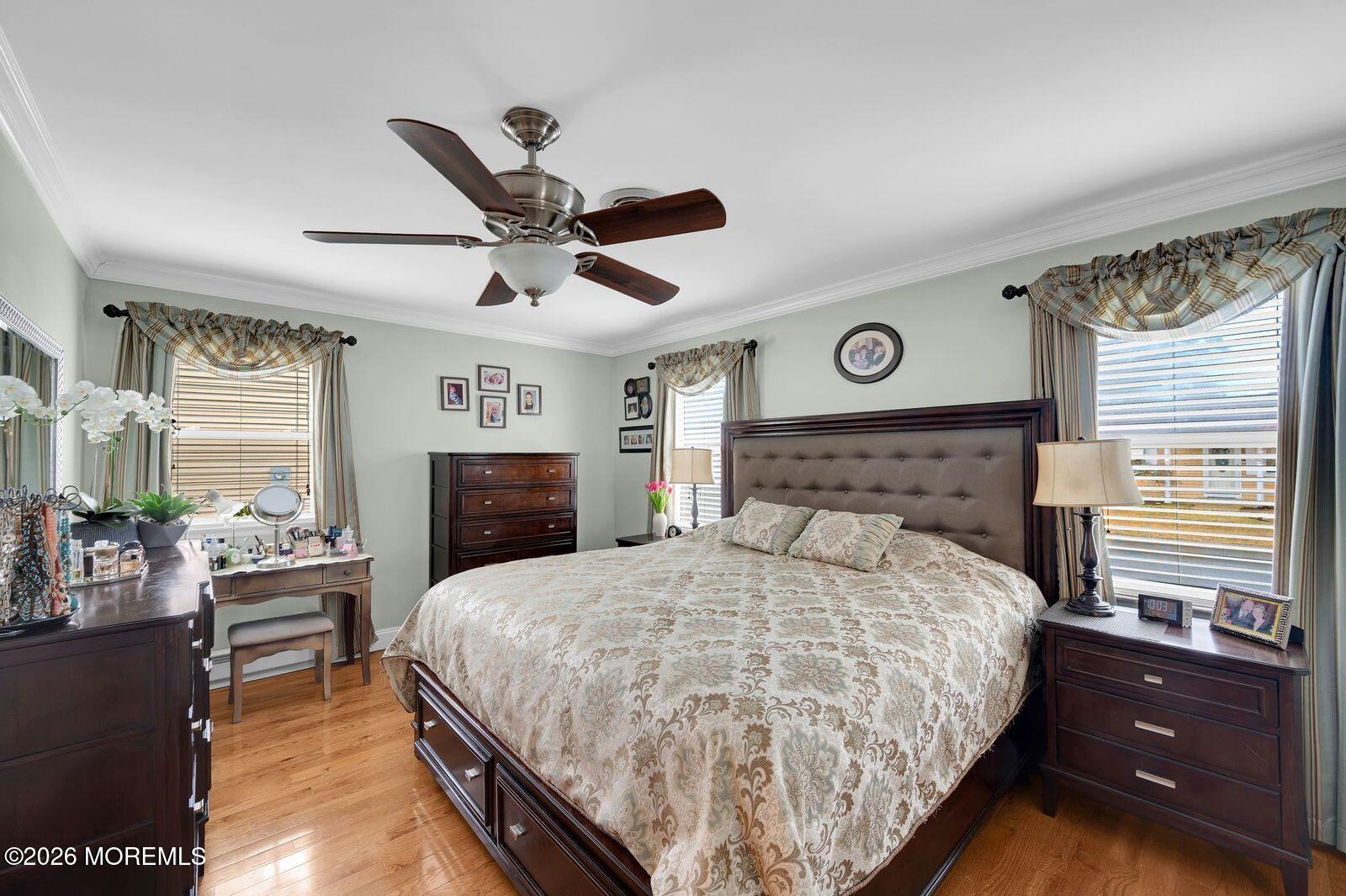 7 Eaton Lane, Unit 73 Whiting, NJ 08759 - Photo 31 of 37 a bedroom with a bed and a chandelier
